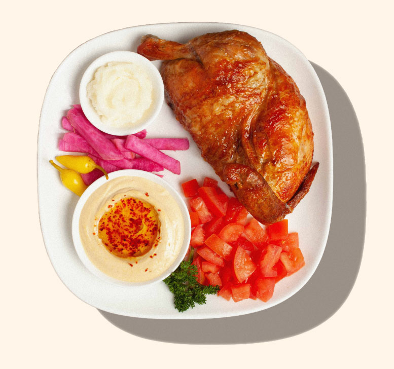 Zankou Chicken half rotisserie chicken plate with Zankou garlic sauce and hummus