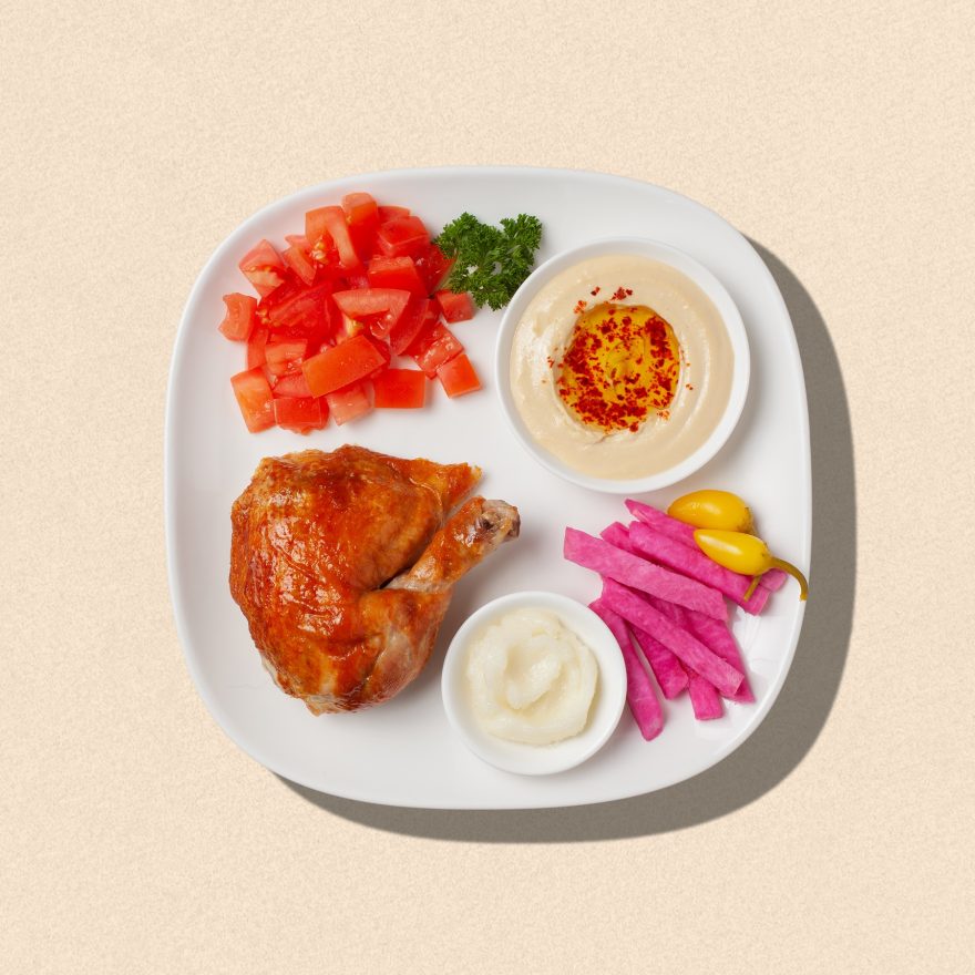 Zankou Chicken quarter rotisserie dark meat chicken plate with Zankou garlic sauce and hummus