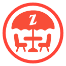 icon-Red icon of 2 chairs at a patio table with a umbrella that has a Zankou Chicken logo